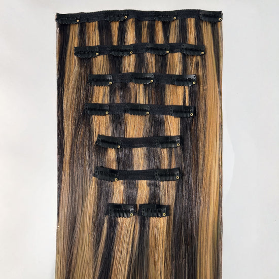 Hair extension with clips on a white background