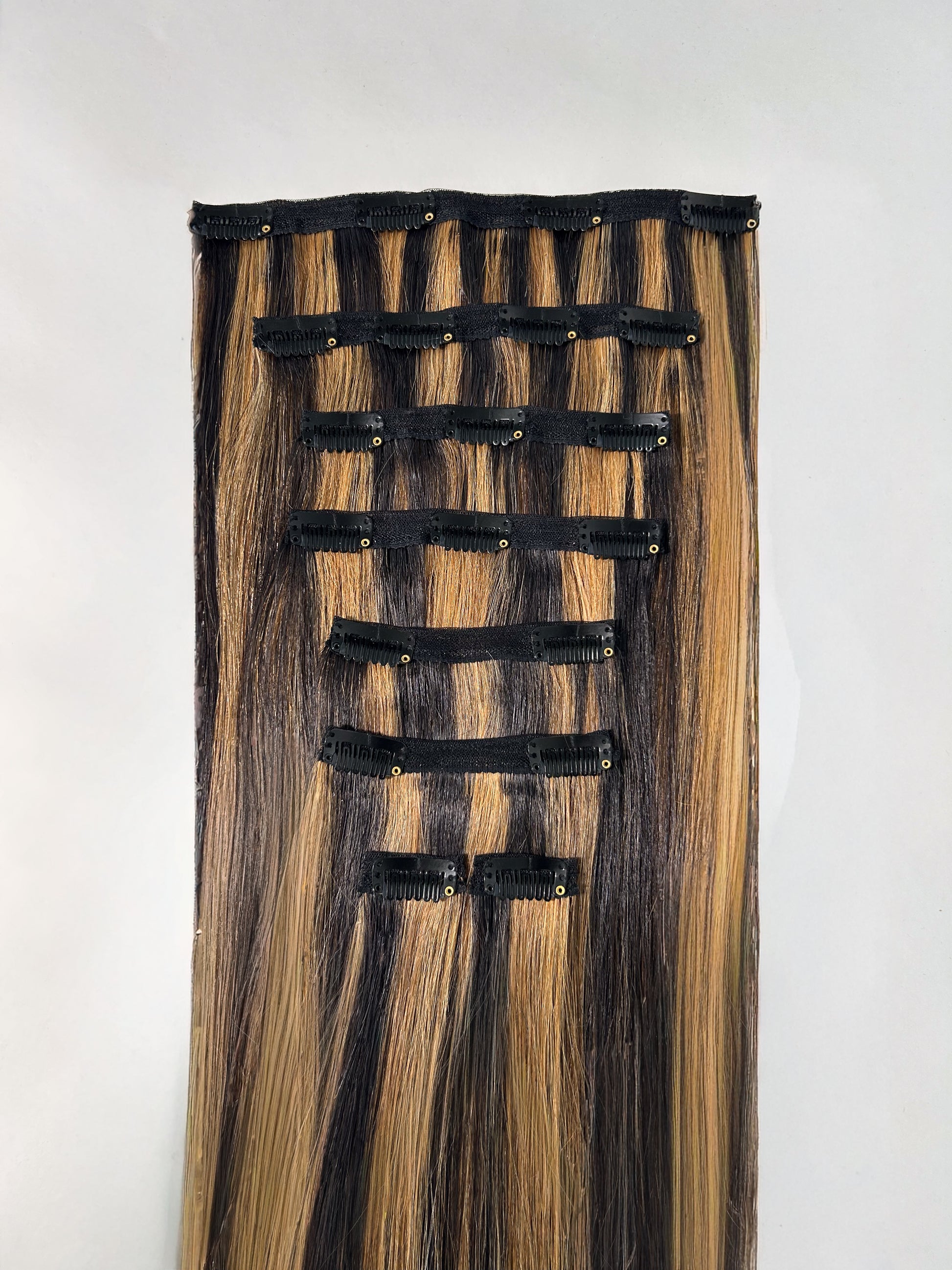 Hair extension with clips on a white background